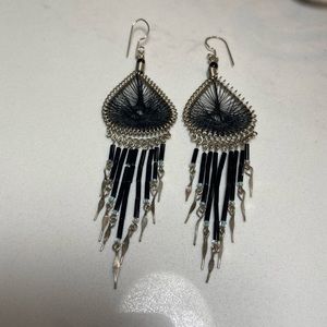 Earrings in intricate weave and beads